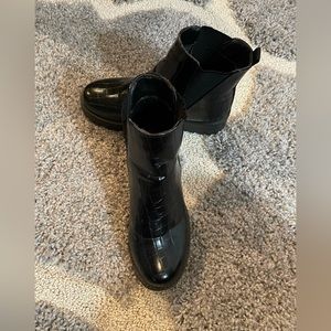 Quipid black patent booties.